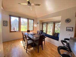 a dining room with a table and chairs at Blue Sky Lodge in Dinner Plain