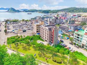 an aerial view of a city with a body of water at Beach Condo Motel in Taean