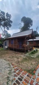 a small house with a gambrel roof at The Nest in Cherating