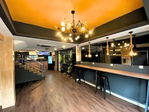 a bar in a restaurant with a chandelier at Seeds Hotel Chow Kit in Kuala Lumpur +36 photos