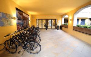 a group of bikes parked in a hallway at Hotel San Rocco in Muggia