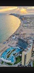 an aerial view of a beach with a hotel and the ocean at Hotel Cuatro Palmas in Puerto Peñasco