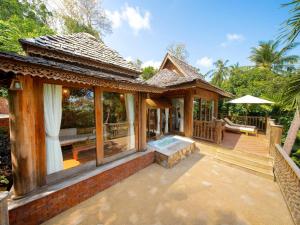 a house with a patio with a hot tub at Santhiya Koh Phangan Resort & Spa - Up to THB 2,000 Resort Credit per Night in Thong Nai Pan Noi