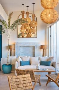 a living room with a couch and a table at Meliá Ibiza - Adults Only in Santa Eularia des Riu +84 photos