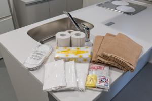 a kitchen counter with a sink with toiletries at MN Building - Vacation STAY 11199 in Nagoya +17 photos
