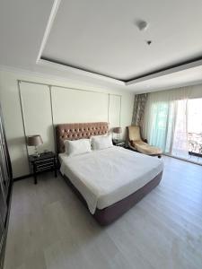 a bedroom with a large bed and a large window at CT Suite in Pattaya South +11 photos