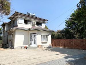 a white house with a fence in front of it at ISU BASE - Vacation STAY 12851 in Shima