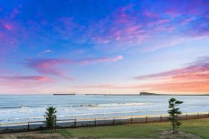 a view of the beach at sunset at Sea Sand and Serenity at Stockton - Stunning Sophistication in Stockton