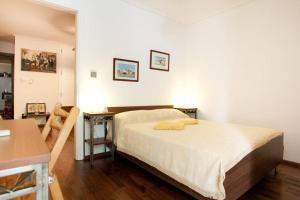 A bed or beds in a room at Veggie Garden Athens B&B