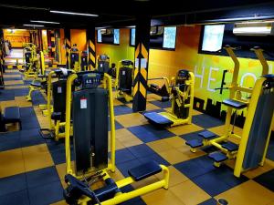 a gym with several rows of tread machines at Ramada by Wyndham Aonang Krabi in Ao Nang Beach