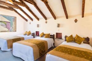 En eller flere senge i et værelse på Pozo del Cielo