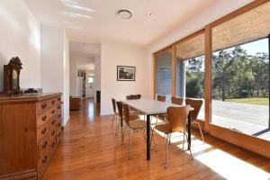 a kitchen and dining room with a table and chairs at The Parsons Retreat in Rothbury