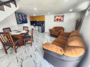 a living room with a couch and a table at departamento para Hospedaje en zacatlan in Zacatlán
