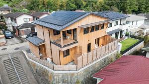 a house with solar panels on top of it at Obaranchi - Vacation STAY 18154 in Kawasaki