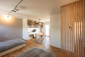 a bedroom with a bed and a desk in a room at Obaranchi - Vacation STAY 18154 in Kawasaki