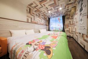 a bedroom with a winnie the pooh bed at R Hotel - Vacation STAY 19199 in Chiba