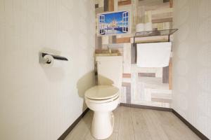 a bathroom with a white toilet in a room at R Hotel - Vacation STAY 19199 in Chiba