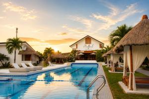 a villa with a swimming pool and a resort at Beyond Island Resort in Moalboal