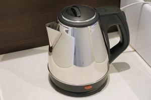 a black and whiteffeepot sitting on a table at R Hotel - Vacation STAY 19198 in Chiba