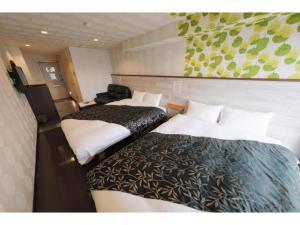 a room with two beds in a room at R Hotel - Vacation STAY 19689 in Chiba