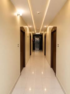 a corridor in a building with a hallway at hotel wisdom celebration in Motīhāri