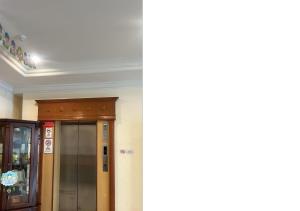 two pictures of a hallway with a door in a building at Kudat Ria Hotel Plt in Kudat