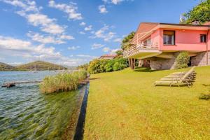 a house on the shore of a body of water at Ranco Villa - 14006 in Ranco