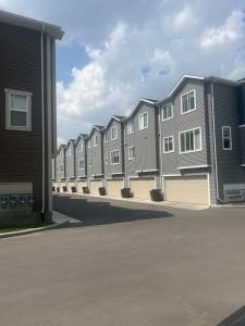 a row of apartment buildings on a street at Southside Haven Edmonton in Edmonton