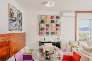 a living room with a glass table and chairs at Ranco Villa - 14006 in Ranco +41 photos