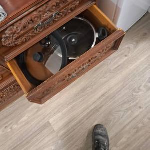 a wooden cabinet with a speaker in a room at 2 Bedroom garden chalet in Rotorua