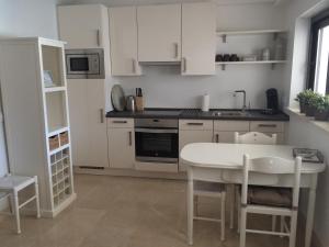 A kitchen or kitchenette at Casa Holandaluzas Marbella near Beach, with salt water Pool and private parking