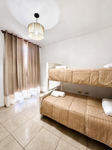 a living room with two beds and a couch at Bohemian dream in Ezeiza