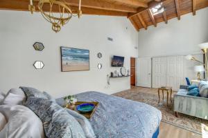 a living room with a couch and a table at NEW Relax & Explore from MissionViejo | Pool | Spa in Mission Viejo +37 photos