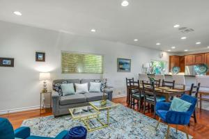 a living room with a couch and a table at NEW Relax & Explore from MissionViejo | Pool | Spa in Mission Viejo