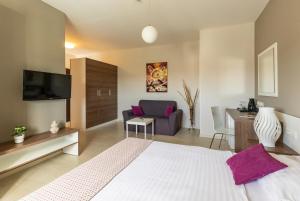a bedroom with a bed and a living room at Villa Badi in Umag