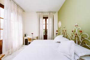 Ένα ή περισσότερα κρεβάτια σε δωμάτιο στο Basic Hotel Doña Manuela