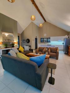 a living room with a couch and a table at Underwood Country Manor in Underberg