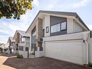 a house with a white garage at Stone River Villa 2 - Private Escape - Heated Pool in Margaret River Town