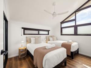 a bedroom with two beds and a window at Stone River Villa 2 - Private Escape - Heated Pool in Margaret River Town