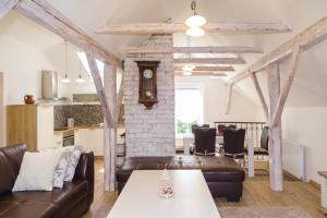 a living room with a couch and a table at Villa Cujez with Pool & Sauna - Happy Rentals in Rečica ob Savinji
