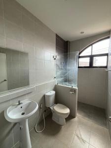 a bathroom with a toilet and a sink at Clock Tower Apartments Chroma Pulse in Pai +41 photos