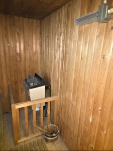 a room with a wooden wall with a laptop in it at Le Chalet Spa Piscine in Rimbach-près-Masevaux