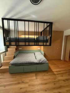 a bedroom with two bunk beds in a room at Apartmán Na Hvězdné Mýtince in Jeseník +2 photos