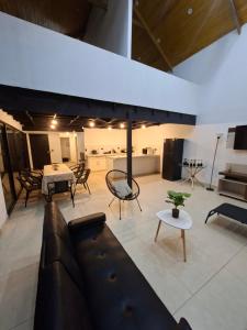 a living room with a couch and a table at Villa Doña Isabel in Lunahuaná