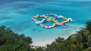 an aerial view of a water park in the ocean at HB'S iSLAND LiFE in Mathiveri