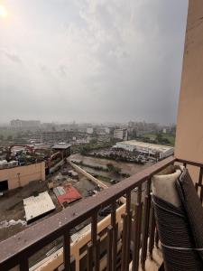 a view of a city from a balcony at Rabbit Stays apartment in Zirakpur +4 photos