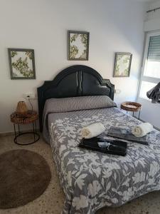 a bedroom with a bed with a tray of food on it at Chalet Lanzada in Sanxenxo