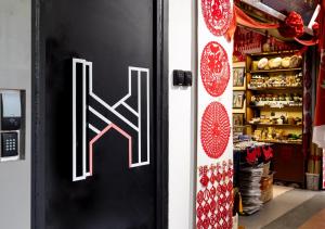 a door with a letter k on it in a store at Heritage Collection on Pagoda - Mobile App Check-In in Singapore +16 photos