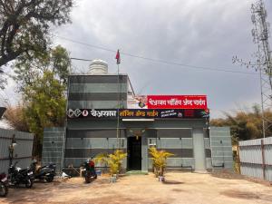 a building with motorcycles parked in front of it at Chairman Lodge in Wanwas Wari