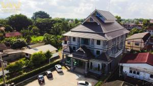 a large house with a gambrel roof at Aiyara Riverine Hotel, Nakhon Phanom in Ban Nong Puk
